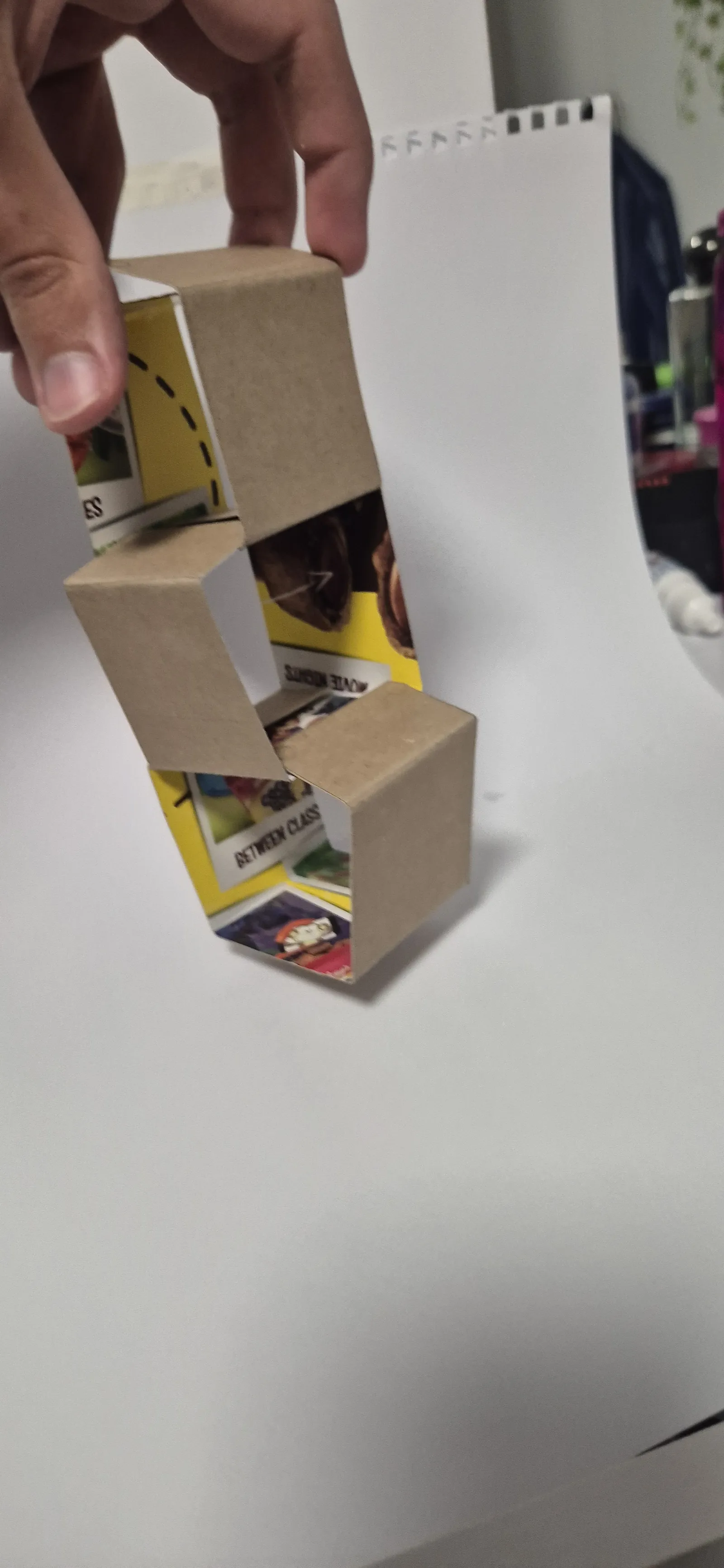 Cardboard prototype held up to test the stacking joint