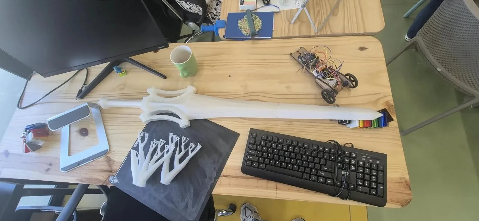 The printed Sword of Power on a studio desk before finishing