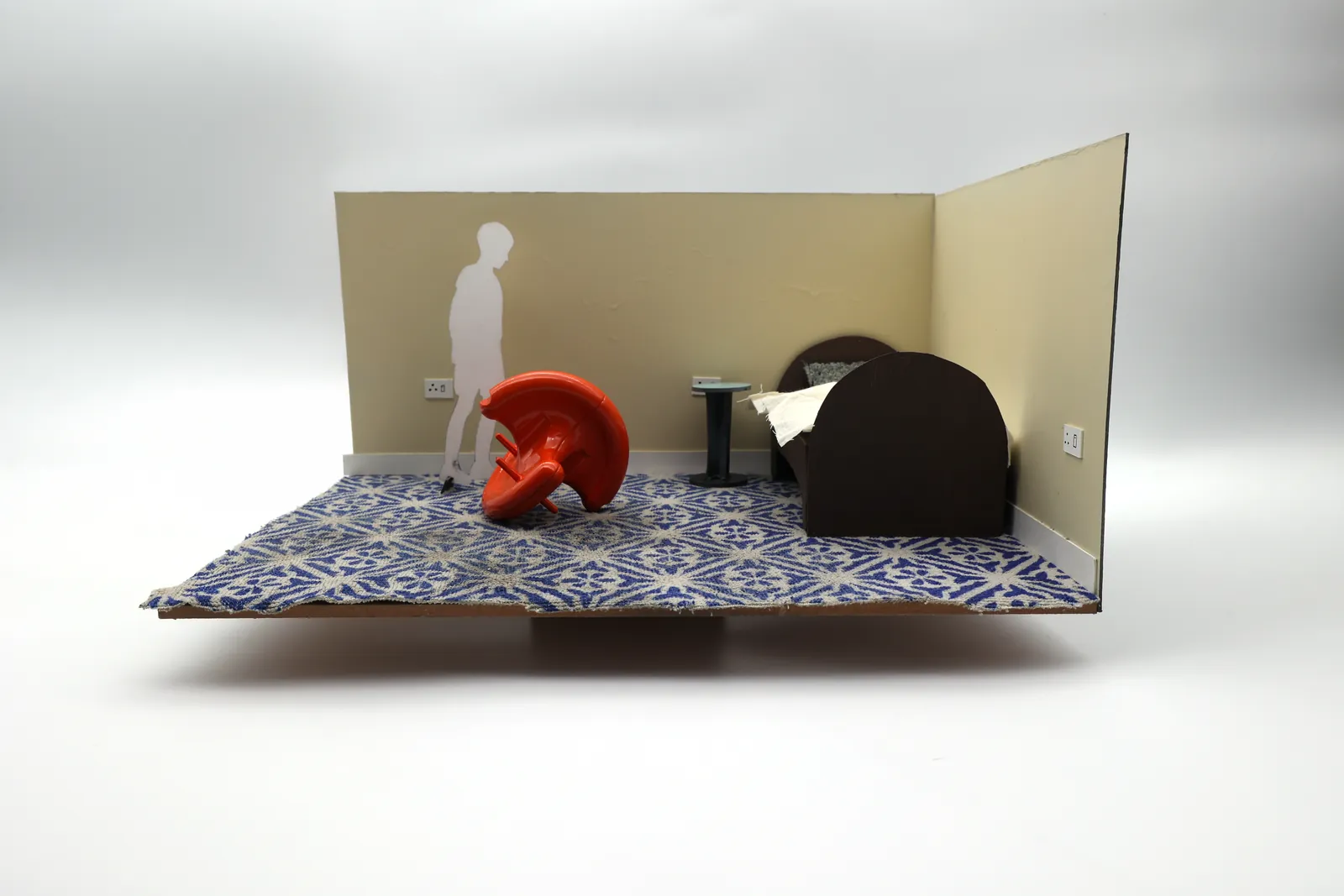 The painted 1:6 FDM model in a scale bedroom with a child figure for scale